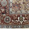 This hand knotted Indo Serapi rug lends a traditional feel to your favorite room. It carries bold geo-floral design elements along with a pleasing balance of soft colors.