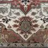 This hand knotted Indo Serapi rug lends a traditional feel to your favorite room. It carries bold geo-floral design elements along with a pleasing balance of soft colors.